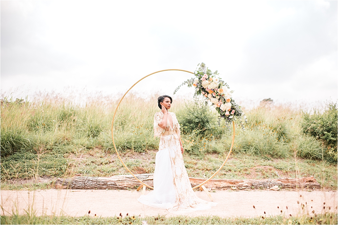 gold boho wedding dress and floral hoop