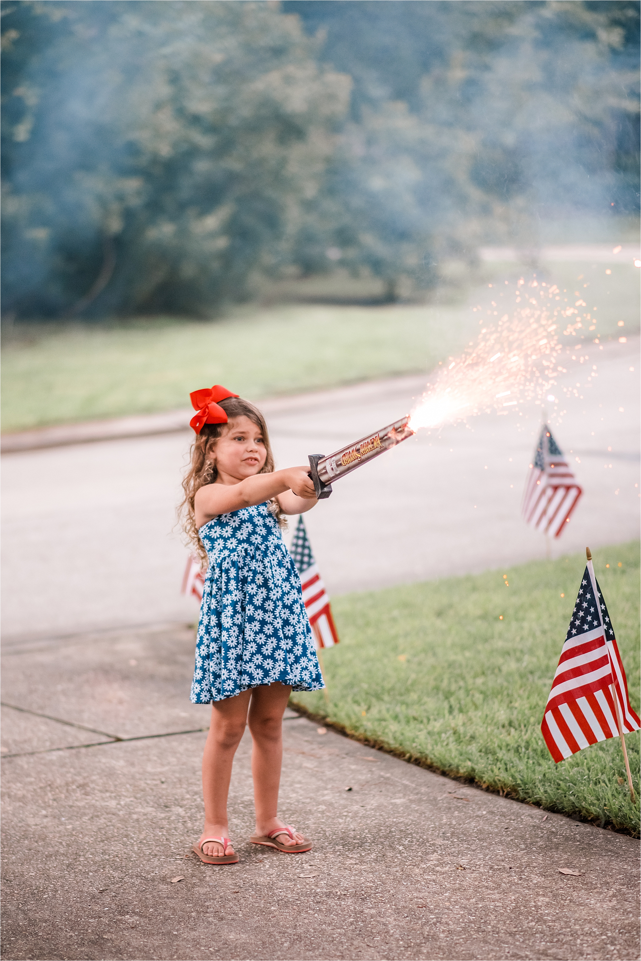 girl with sparkler sword on the 4th of July 