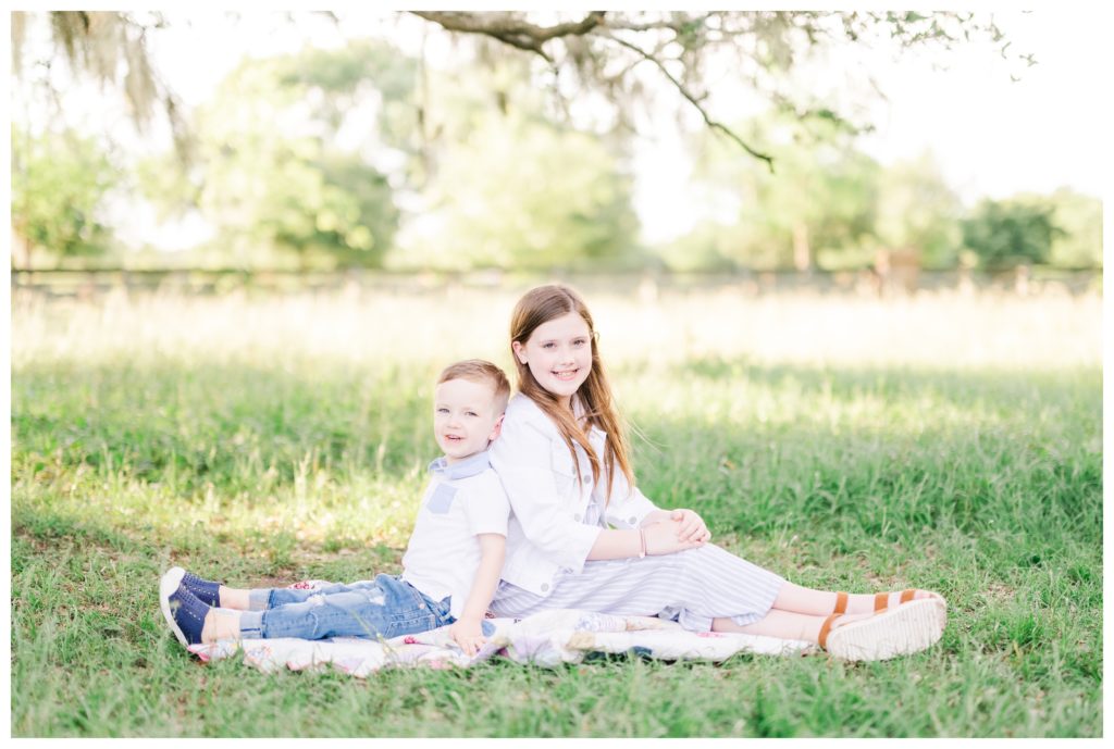 brother and sister at mossy oak photo session in The Woodlands Texas