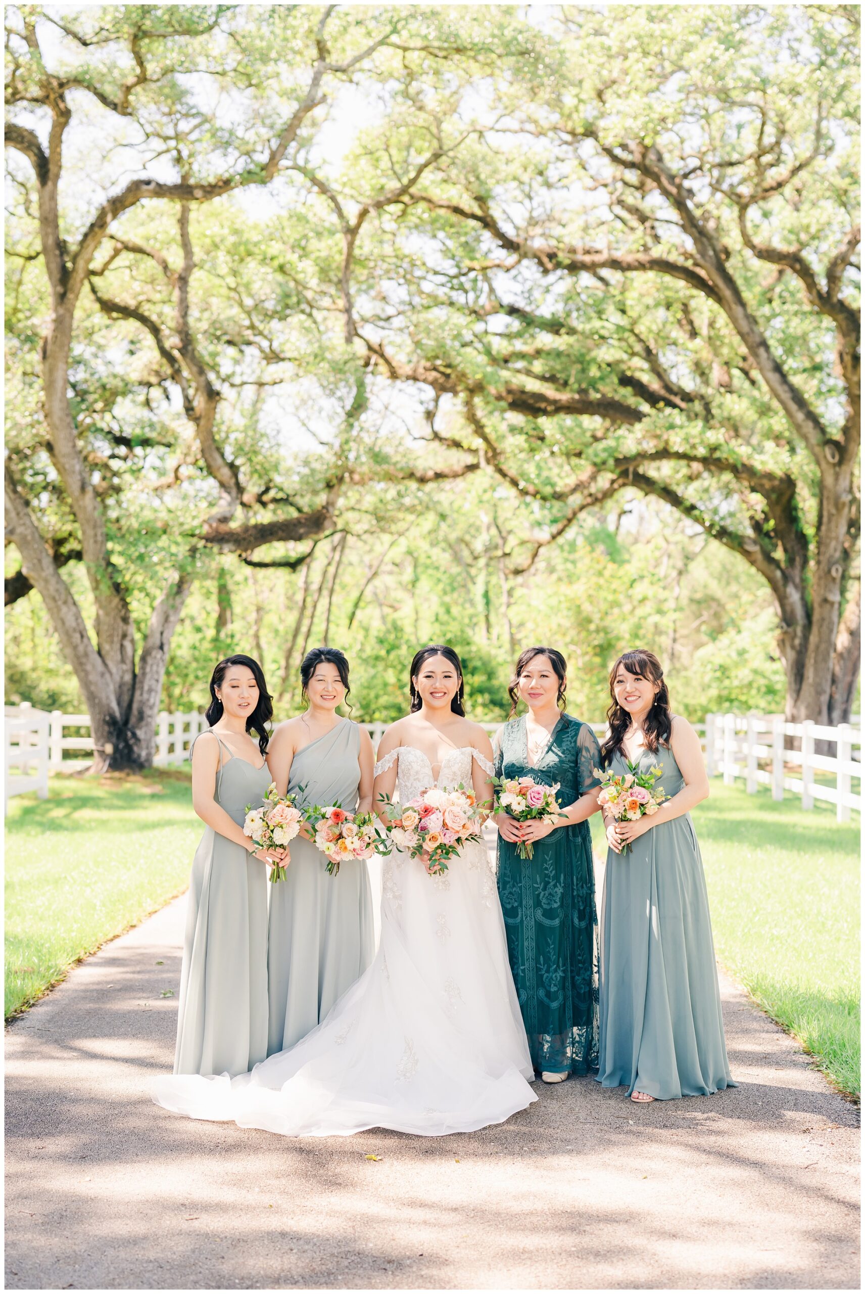 Bridesmaids outside on the path at magnolia manor