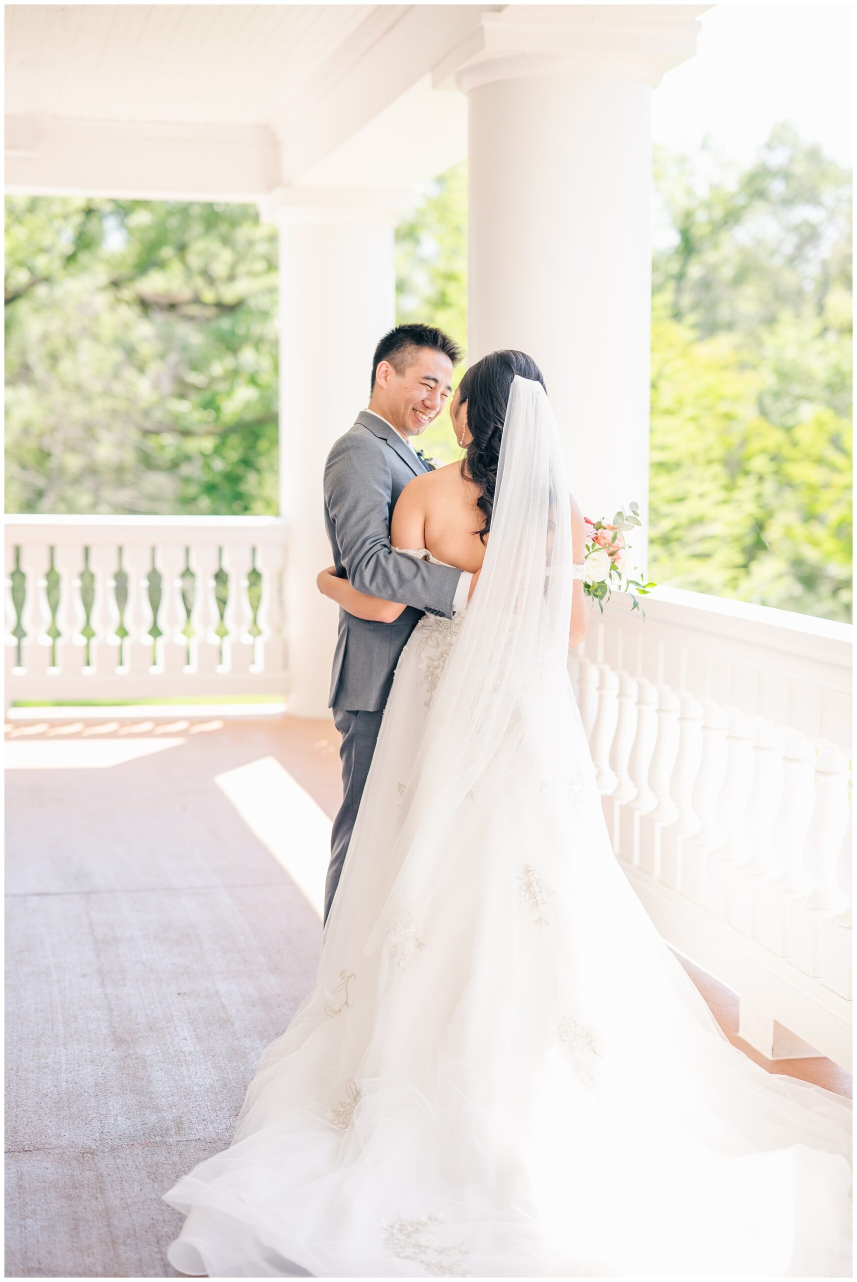 first look portrait on the balcony at Magnolia Manor