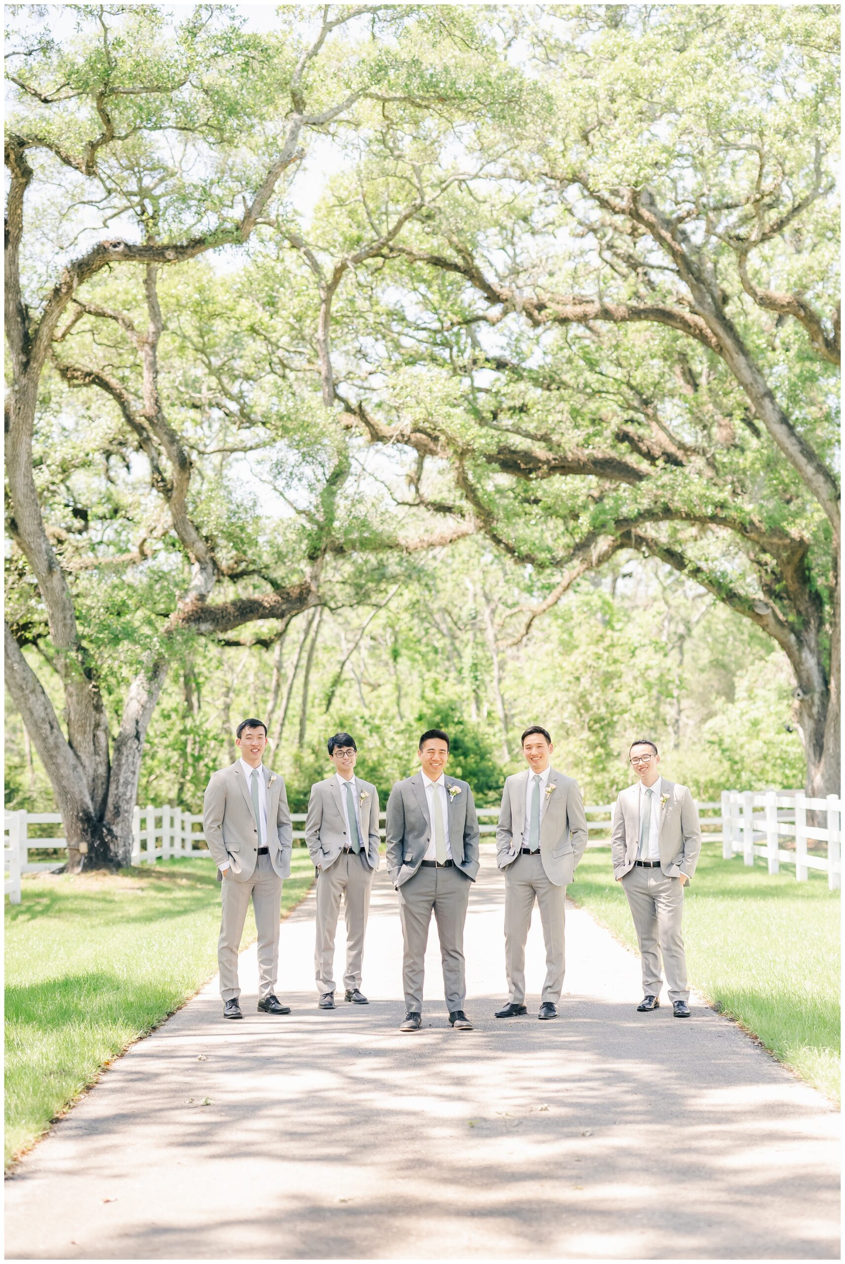 groomsmen on the path outside at magnolia manor