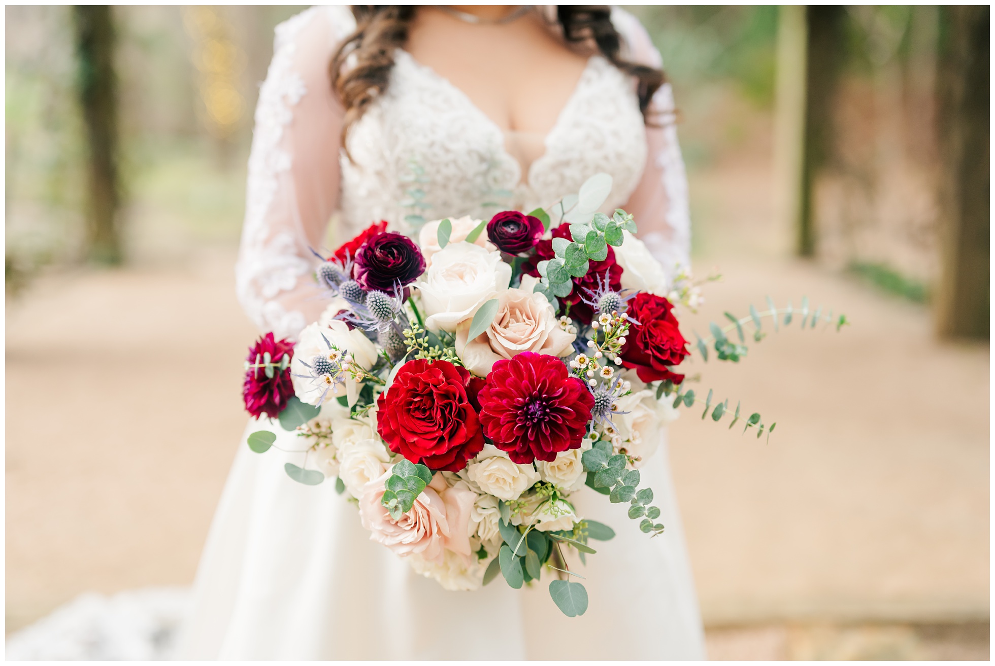 Bride's bouquet of red, pink, and white florals by HEB Blooms magnolia.