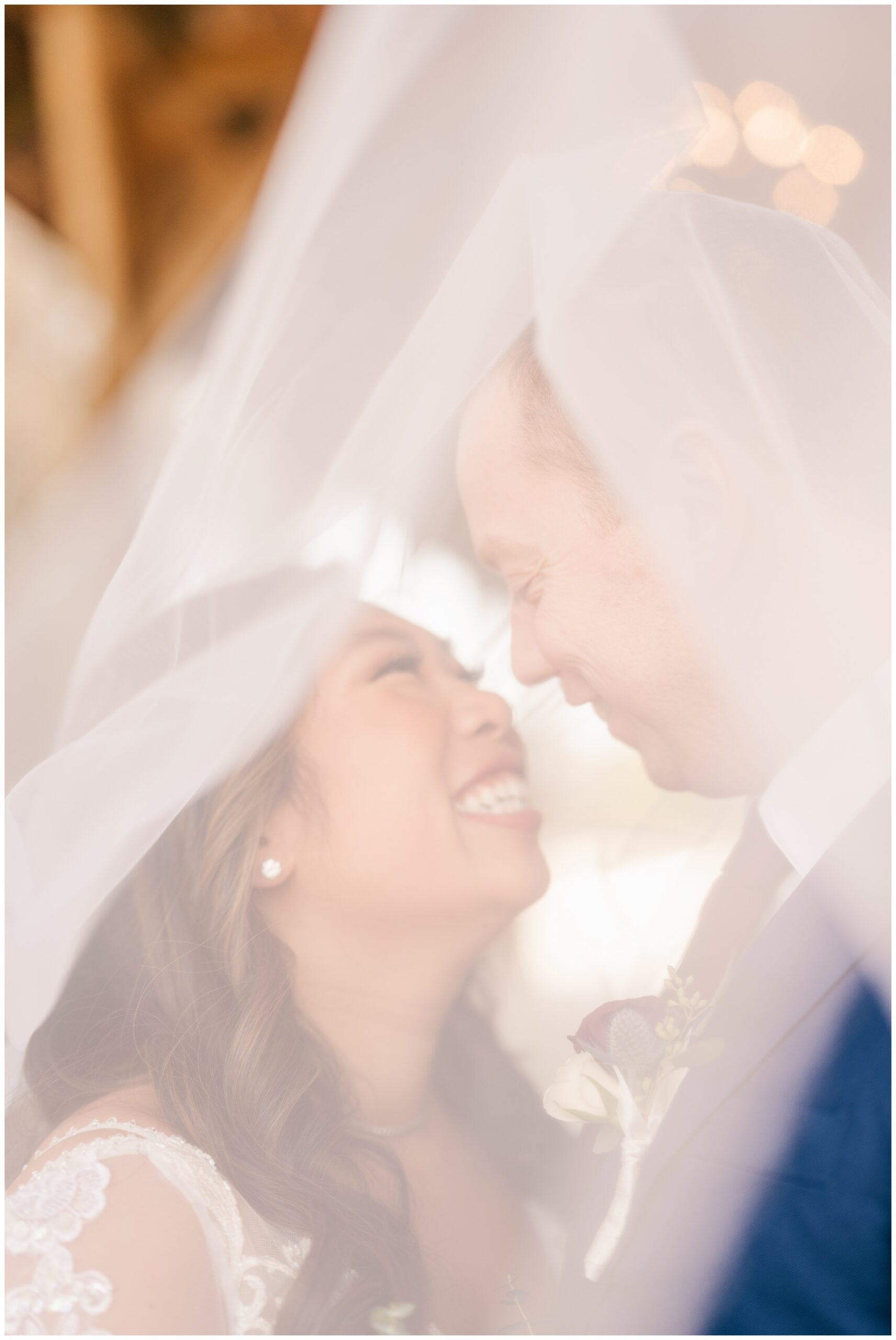 Soft Portrait of Bride and Groom under veil by Relics of Rainbows Photo.